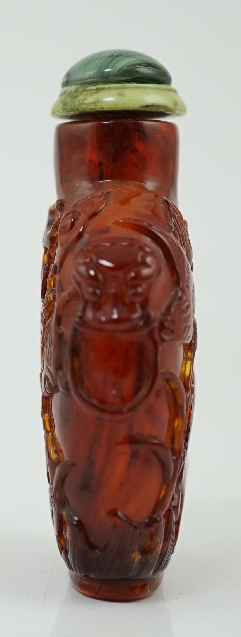 A Chinese carved amber snuff bottle, 19th century